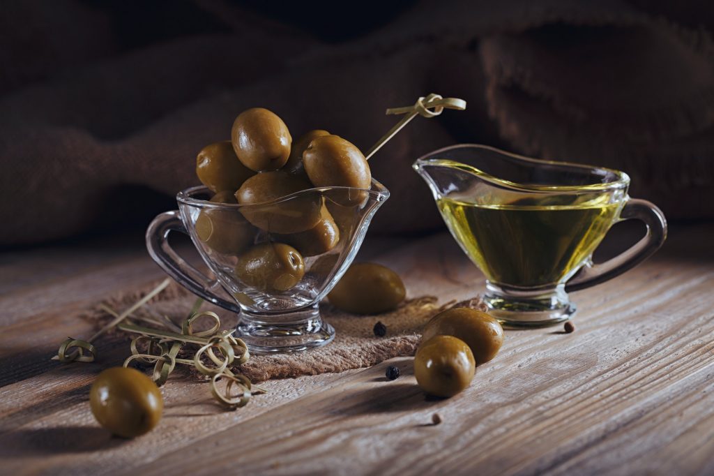 Premium extra virgin olive oil and green olives